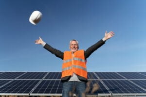 person near alternative energy plant