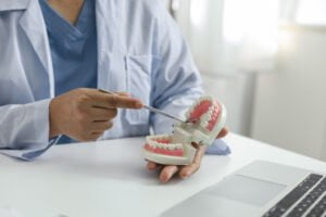 dentist examining patient teeth medical treatment dental clinic